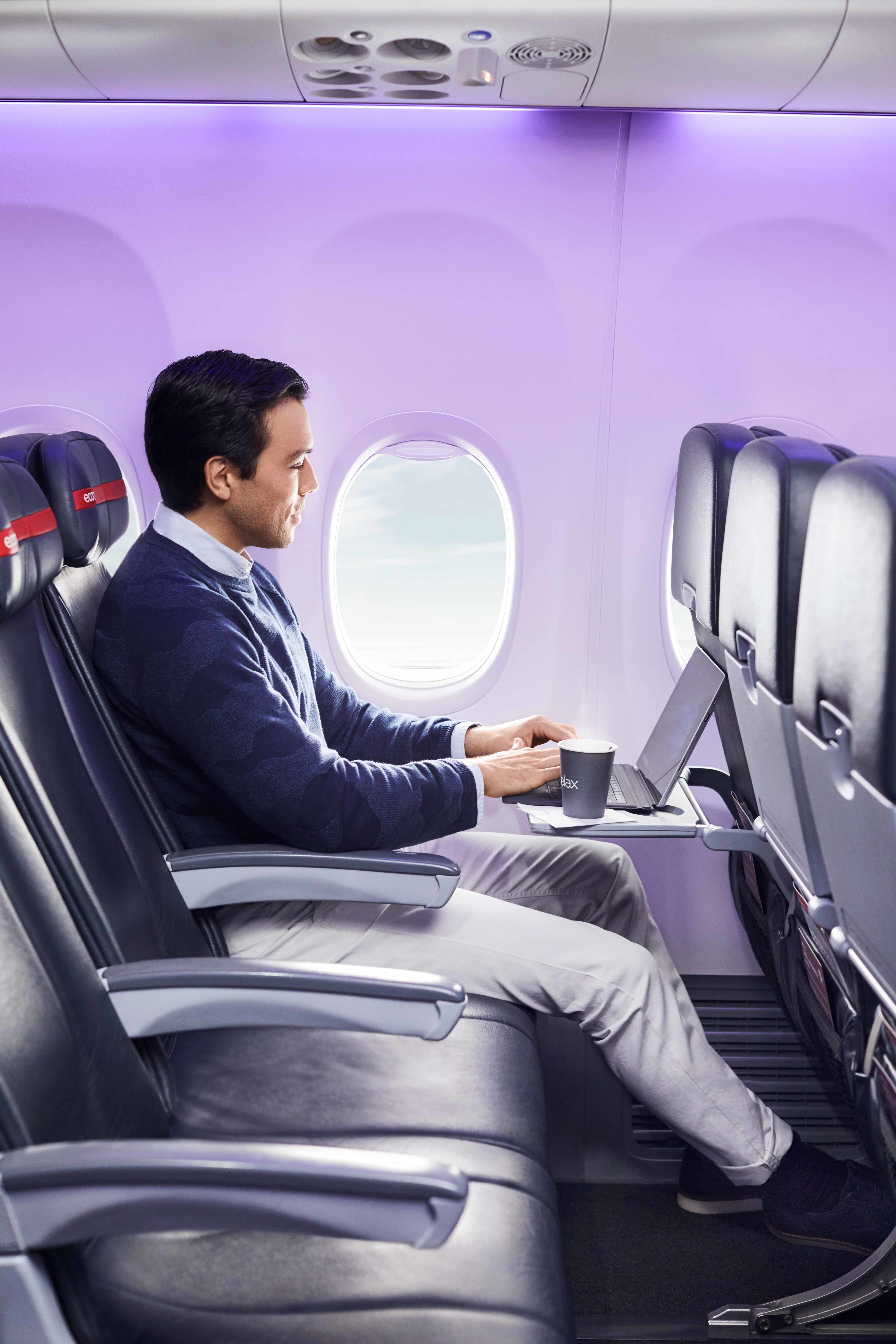 Virgin Australia man enjoying flight