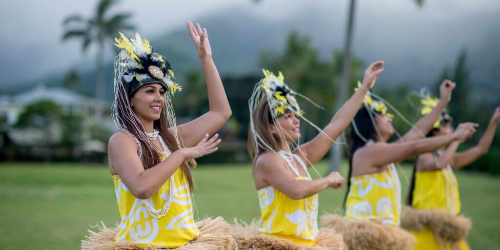 A group of women doing the hula during a luau